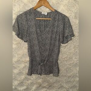 Black and white print/ sinched waist. Tie on bottom.